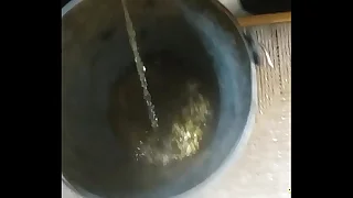 Peeing regarding a bucket